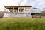 The greenhouse acts as a passive heater as warm air rises up into the living space above