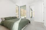Bedroom, Bed, Ceramic Tile Floor, and Ceiling Lighting  Photo 11 of 20 in Forest House by Métamaison