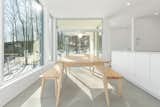 Dining Room, Bench, Ceramic Tile Floor, Pendant Lighting, and Table  Photo 9 of 20 in Forest House by Métamaison