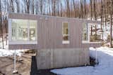 Exterior, House Building Type, Wood Siding Material, Flat RoofLine, and Metal Siding Material  Photo 2 of 20 in Forest House by Métamaison