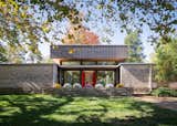 Topped by a distinctive mansard roof "hat," this midcentury house in Belle Meade, Tennessee, was renovated and reimagined for contemporary family living by Nashville architect Michael Goorevich with builder Giachery Lizarraga of Hybrid Phoenix.