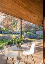 A large covered patio in the backyard offers the family opportunities for outdoor dining.