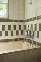 After: Spencer and Alessio tiled the bathrooms themselves, modeling the pattern in this one on the ground floor after a vintage men's locker room.