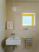 Waterproof tadelakt covers the bathroom, where the fixtures are from Vola.