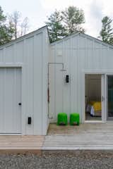 The back patio now offers an outdoor shower, and the mechanical shed has been rebuilt to match the home's architecture.
