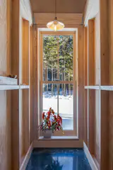 Large, double hung windows by Marvin pull sunlight into the home's interior, which is built with finish-grade plywood from Hammond Lumber. 