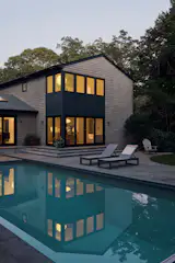 Large Anderson 400 series windows and doors create new indoor-outdoor access to the pool from the living room and dining area.
