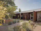 Architect and homeowner Christopher Alt designed the home's pivoting sun shades with Thermory wood slats and FritzJurgens hardware.