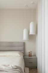 The absolute favorite elements in the interior are the bedroom light fixtures. They diffuse light very softly, and through the small openings, the light creates a beautiful pattern on the wall.