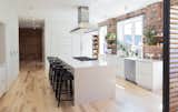 Kitchen, White Cabinet, Light Hardwood Floor, and Engineered Quartz Counter Kitchen  Photo 1 of 6 in 1675 Madison by Josh Hartman