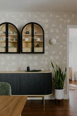 Dining Room, Shelves, Chair, Table, Storage, Wall Lighting, and Dark Hardwood Floor Dining Room  Photo 4 of 6 in The Mehta Residence by Milena Bica-Shibata