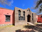 The front facade of Adobe Mission at Rancho de los Cerros is built with authentic, hand-made adobe and towering stained glass windows that bring in inspiring sunlight.