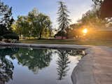 The lagoon pool reflects the setting sun at Rancho de los Cerros.
