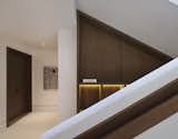 Basement Circulation - Lights: Flos Shadow Dot; Art: Saqiba Suleman, 36 x 48 inches, Mixed Media on Canvas; Materials: Portland Limestone with Pillow Finish, Oak Wood Walnut Stained, Mahogany Wood