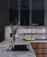 Family Kitchen - Furniture: Dada S.p.A Matt MOKA and Eucalyptus Cabinetry, Smoke Glass, Pewter Finish Skirting, Pewter Finish Profile, Fantasy Grey Counter Top, Eucalyptus Breakfast Counter