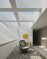 Circulation – Lights: Flos Shadow Dot; Furniture: Paola Lenti Rope Corda 10 Orbitry Suspended Seat; Art: 24k II, ARK, 36 inches, Acrylic Texture Paste and 24 Karat Gold; Materials: Textured Paint, Portland Limestone with Pillow Finish, Mahoghany Wood