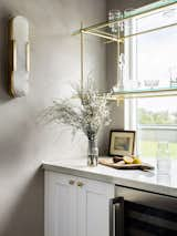 Dry bar - Lime wash paint, custom brass shelving 