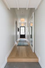 Hallway, Light Hardwood Floor, and Concrete Floor Hallway  Photo 1 of 13 in Villa Sandringham by KKID