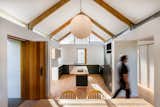 Kitchen, Recessed Lighting, Pendant Lighting, Light Hardwood Floor, Ceiling Lighting, Quartzite Counter, Refrigerator, Dishwasher, Drop In Sink, Colorful Cabinet, Wood Counter, and Cooktops  Photo 15 of 21 in House Swanepoel by KLG Architects