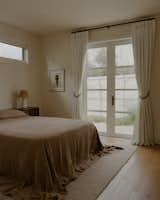 Bedroom, Lamps, Table Lighting, Medium Hardwood Floor, and Bed Master Bedroom  Photo 8 of 8 in Casita M by Emily Evans
