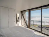 Even the Loft-Level Netting Has Water Views at This Chilean Beach House - Photo 21 of 26 -