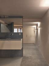 Bath Room, Ceramic Tile Wall, Ceramic Tile Floor, Tile Counter, Drop In Sink, and Concrete Floor  Photo 13 of 28 in Garage Loft Delfshaven by Kumiki