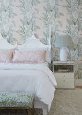  The bed is from Circa Who, dressed in Dea linens and Schumacher fabric pillows. The nightstand and lamp, topped with Ballard Designs’ Lynx shade, are from Palm Beach Regency. 