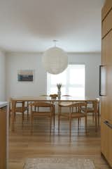 Dining Room- featuring custom dining table and chairs, linen globe pendant 