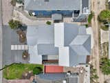 Exterior, House Building Type, Gable RoofLine, Stucco Siding Material, Hipped RoofLine, Metal Roof Material, Beach House Building Type, and Shed RoofLine Aerial roof  Photo 9 of 27 in Wave House by DAVID GRUSSGOTT