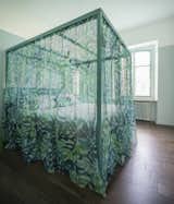 The four-poster bed, which has a powder coated iron frame and was designed by the architect, is a sort of ‘room within a room’.