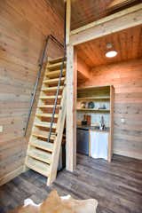 The Barn at Edenwood's loft ladder (built to code) and kitchenette efficiently spaced behind the loft ladder (photo credit Aerial Photo Pros)