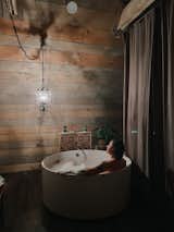 Bath Room, Freestanding Tub, Soaking Tub, Recessed Lighting, and Pendant Lighting The Barn at Edenwood Loft at Night by chandelier light (photo credit The Hive Drive)  Photo 16 of 35 in The Barn at Edenwood NC by Catherine Morris