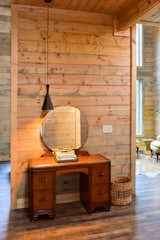 Entry Area to The Barn at Edenwood features vintage reclaimed dresser and mirror to welcome guests with modern light fixture (photo credit Aerial Photo Pros)