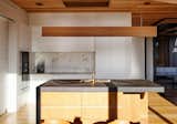 Kitchen, Porcelain Tile Backsplashe, Light Hardwood Floor, White Cabinet, Pendant Lighting, Recessed Lighting, Drop In Sink, and Wall Oven Kitchen  Photo 9 of 16 in Whangārei House by Herriot Melhuish O'Neill Architects