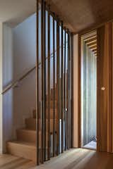 Staircase, Wood Railing, and Wood Tread Stair and front door  Photo 9 of 10 in Peka Peka House II by Herriot Melhuish O'Neill Architects