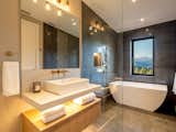 One of four ensuites. This bathroom is a wet room design separated by a frameless glass panel to not disrupt the view from any angle. 