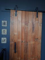 Living Room One of 4 barn doors made by my husband  from recycled floorboards.   Photo 15 of 17 in Junction St Rebuild by Rachel Graham-Hilder
