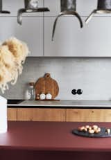 Kitchen, Drop In Sink, Wood Cabinet, Pendant Lighting, Concrete Backsplashe, Concrete Counter, and Colorful Cabinet  Photo 12 of 25 in Love Apartment by Liubov Lazoriv