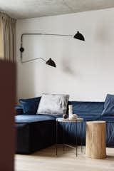 Living Room, Wall Lighting, Sofa, Light Hardwood Floor, and Coffee Tables  Photo 6 of 25 in Love Apartment by Liubov Lazoriv