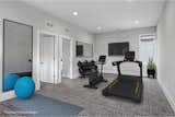 Main Floor Flex Room as a Home Gym  Photo 17 of 21 in Custom Modern with Skyline Views in Belknap Lookout by Kellie Kalish