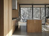 Kitchen, Recessed Lighting, Wood Cabinet, Cooktops, Undermount Sink, Stone Counter, Stone Slab Backsplashe, Wall Oven, and Concrete Floor  Photo 10 of 42 in Résidence du Rang Ste-Mathilde by Jérôme Lapierre Architecte
