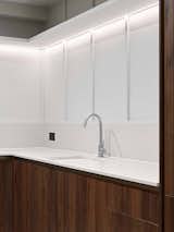 Kitchen, Recessed Lighting, Granite Counter, Light Hardwood Floor, Engineered Quartz Counter, Wood Cabinet, and Wall Lighting Kitchen Detail   Photo 8 of 20 in Knightsbridge Apartment by Georgios Apostolopoulos