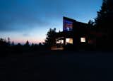 Exterior, Metal Roof Material, Shed RoofLine, House Building Type, and Wood Siding Material Twilight, overlooking the Pacific Ocean  Photo 1 of 10 in The Sea Ranch House at the Airfield by Bill Oxford