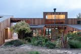 Exterior, House Building Type, Metal Roof Material, Wood Siding Material, and Shed RoofLine Lush garden and courtyard.  Photo 3 of 10 in The Sea Ranch House at the Airfield by Bill Oxford