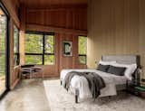 Bedroom with post-and-beam construction. 