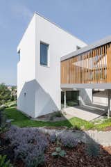 Exterior, Wood Siding Material, Stucco Siding Material, Flat RoofLine, Glass Siding Material, and House Building Type  Photo 6 of 23 in Villa in Budapest by Luca Mudry
