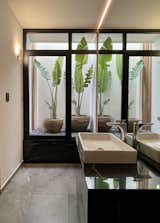 Bath Room, Porcelain Tile Floor, Granite Counter, and Soaking Tub  Photo 14 of 15 in Casa Luna by Fred Dionne