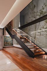 Staircase, Glass Railing, Wood Tread, and Metal Railing  Photo 3 of 15 in Casa Luna by Fred Dionne