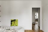 Bedroom, Light Hardwood Floor, Wall Lighting, Bed, and Ceiling Lighting  Photo 18 of 24 in R Apartment by Olga Chut