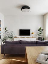 Living Room, Wall Lighting, Sofa, Ceiling Lighting, and Light Hardwood Floor  Photo 8 of 24 in R Apartment by Olga Chut